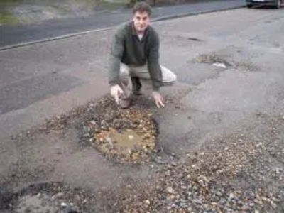 David Goodall inspects just one of the many potholes appearing on Southampton patched road network