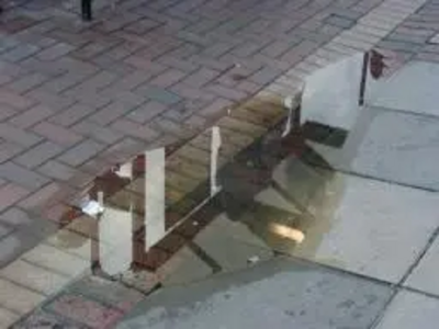 Puddle by the bus stop