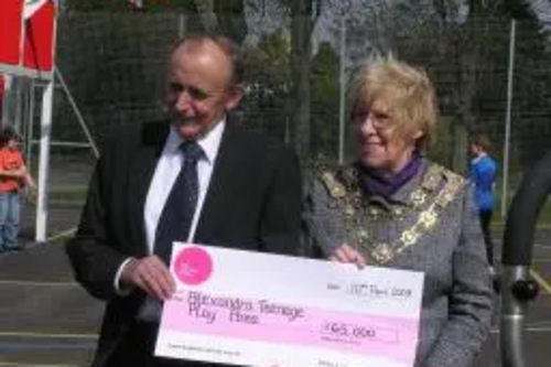 Mayor receiving cheque