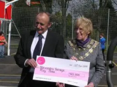 Mayor receiving cheque