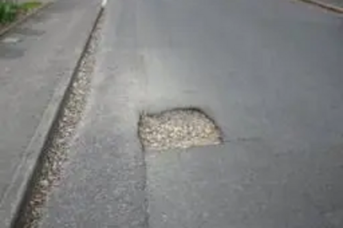 Downs Hill Road pothole before repair