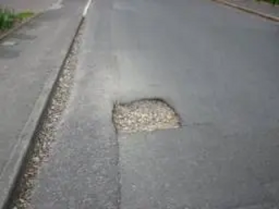 Downs Hill Road pothole before repair