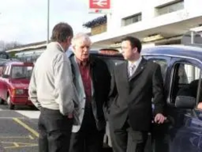 Jonathan Lees & Colin Taylor outside Epsom Station with a Taxi Operator